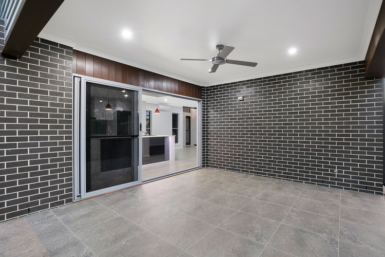 Grey brick patio area with slate tile floors