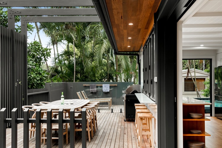 Patio area with grey fence and dining area