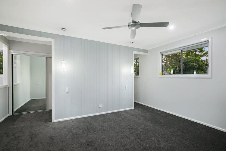 Grey panelled bedroom feature wall and robe