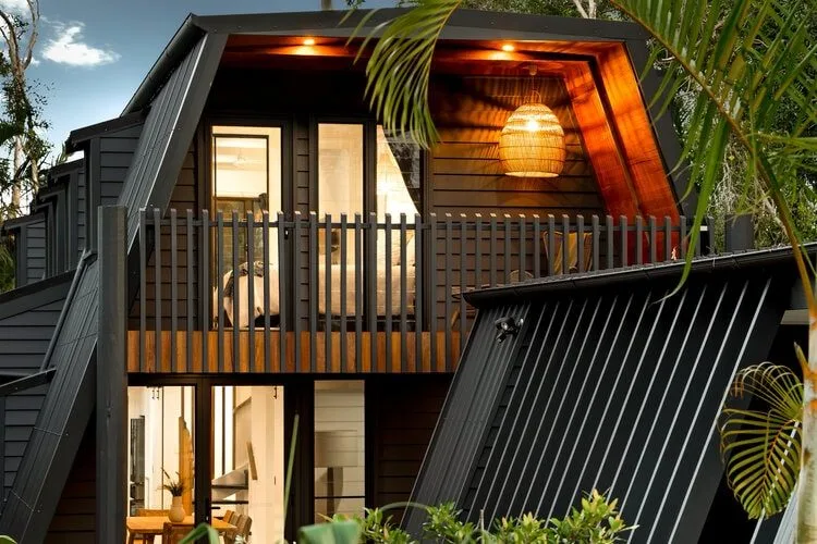 Grey A Frame house with evening lights