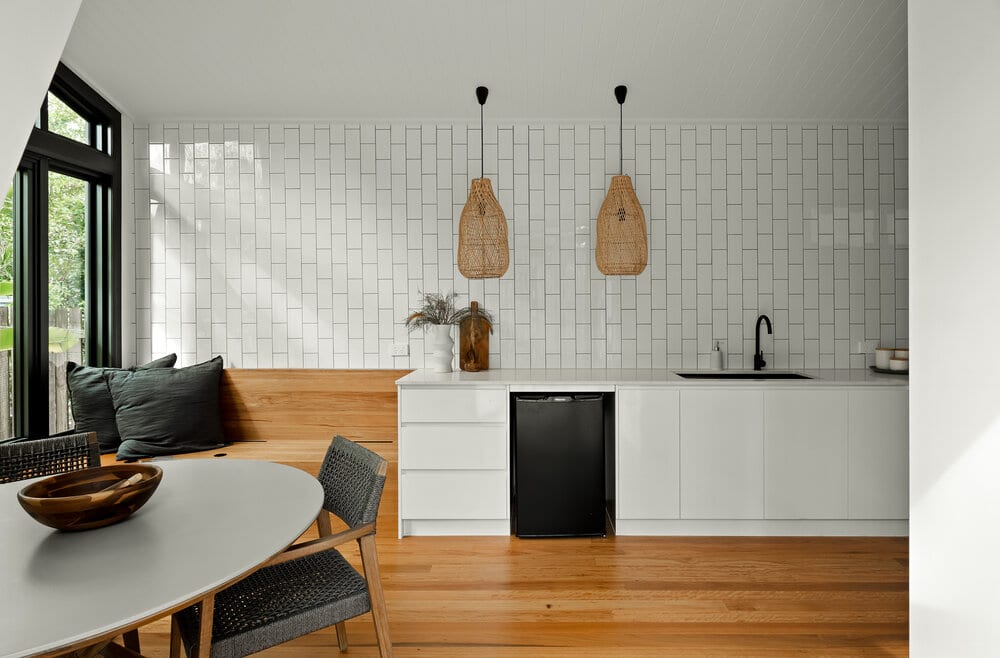 Indoor kitchen area with black dishwasher and table
