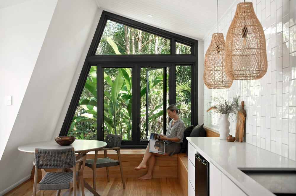 Small kitchen alcove with timber floors and white walls