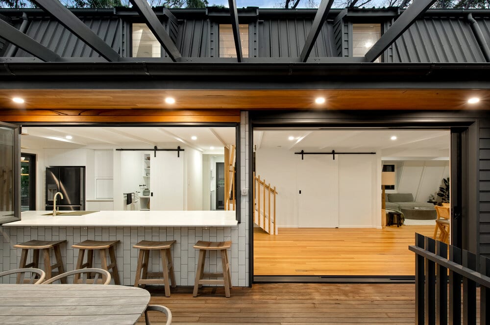Grey modern home with open bar and entryway