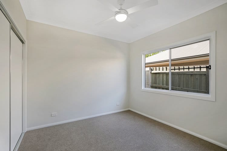New home with sliding wardrobe and white window