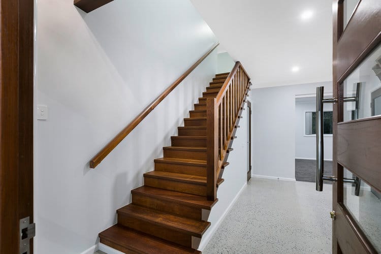 Entry area with timber stairs and door