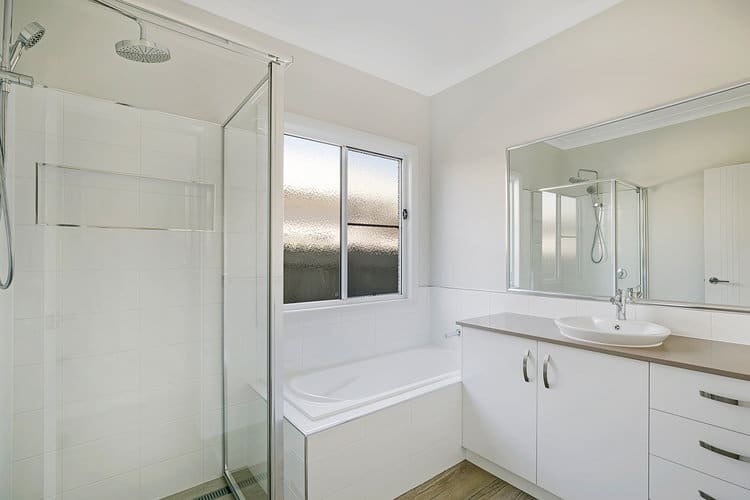 White shower, bath and vanity