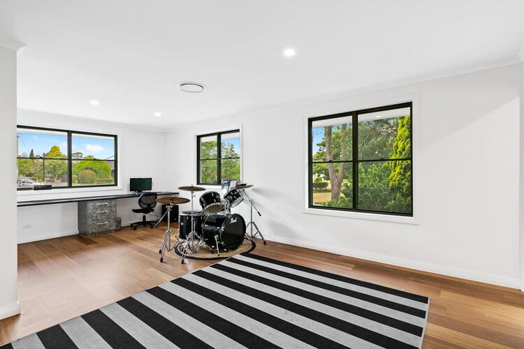 White office space with timber floor and striped carpets