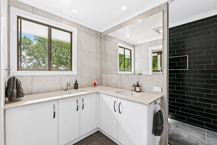 White bathroom with black feature wall