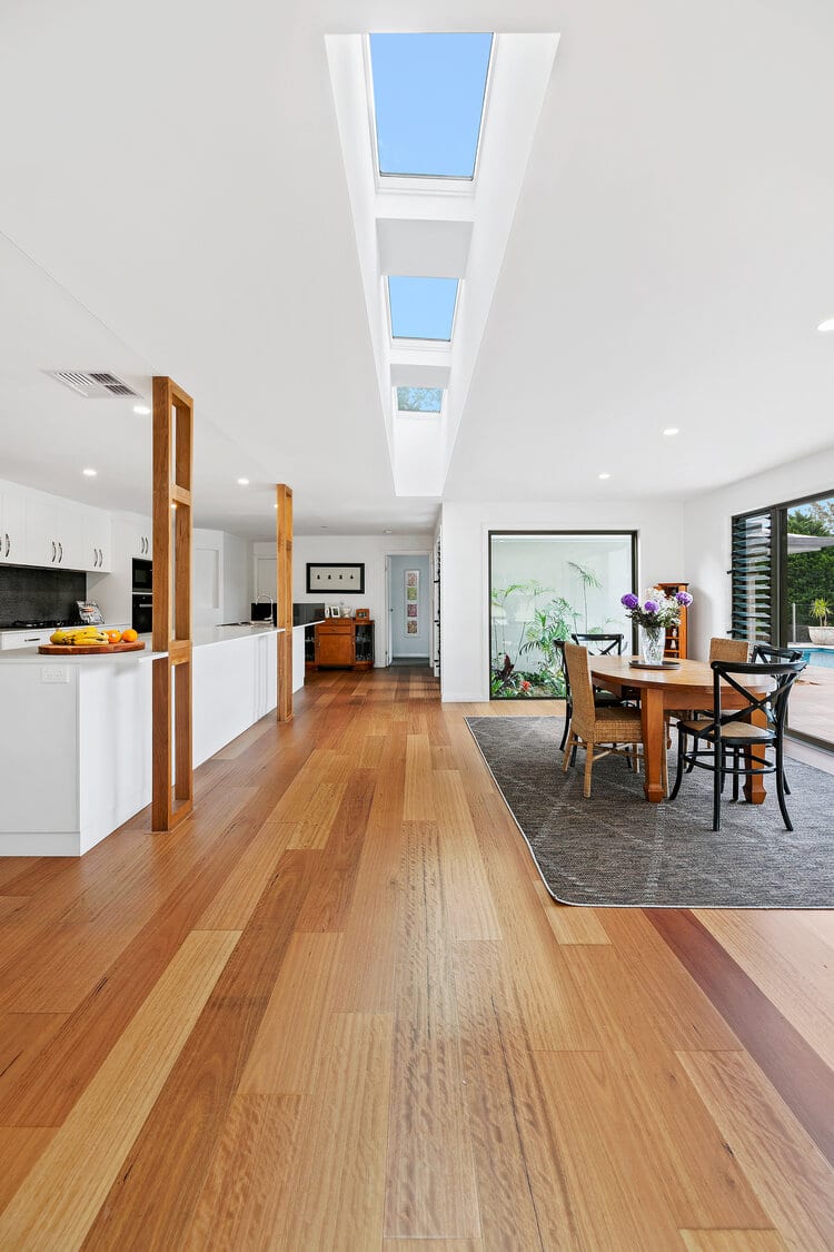 White open living area with timber floors