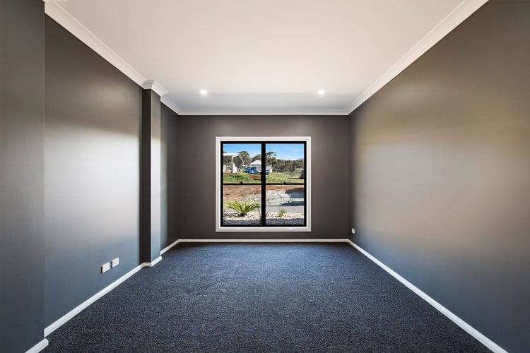 Dark grey walls and grey carpets in empty bedroom