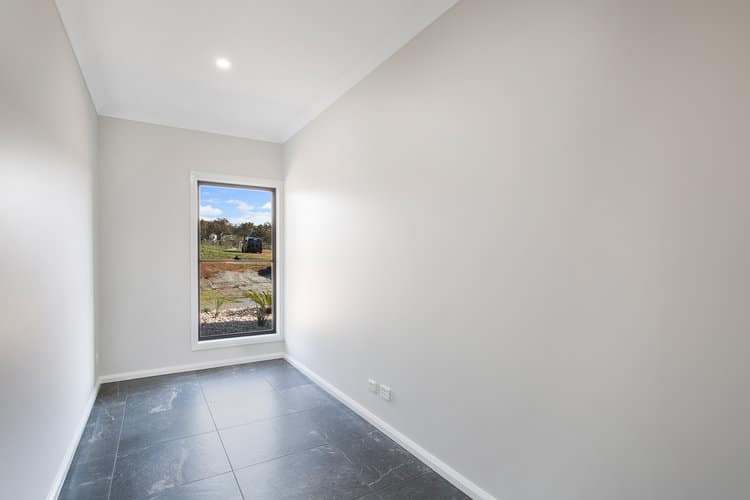 Empty white room with grey tile flooring
