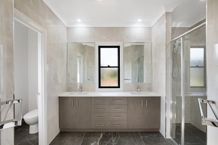 Grey and white bathroom with tiled walls