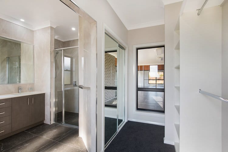Grey and white ensuite with walk in wardrobe