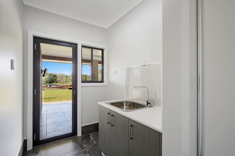 Grey and white laundry with tile floors