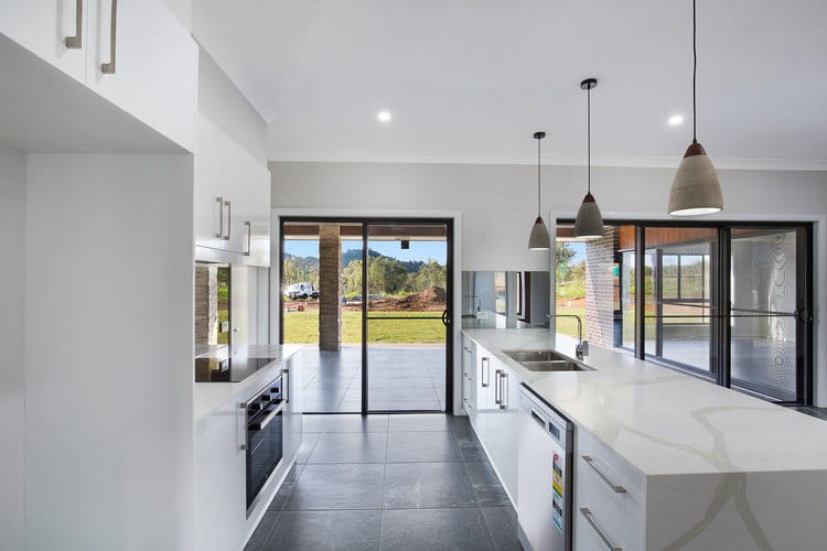 White kitchen with dishwasher and laminate benchtops
