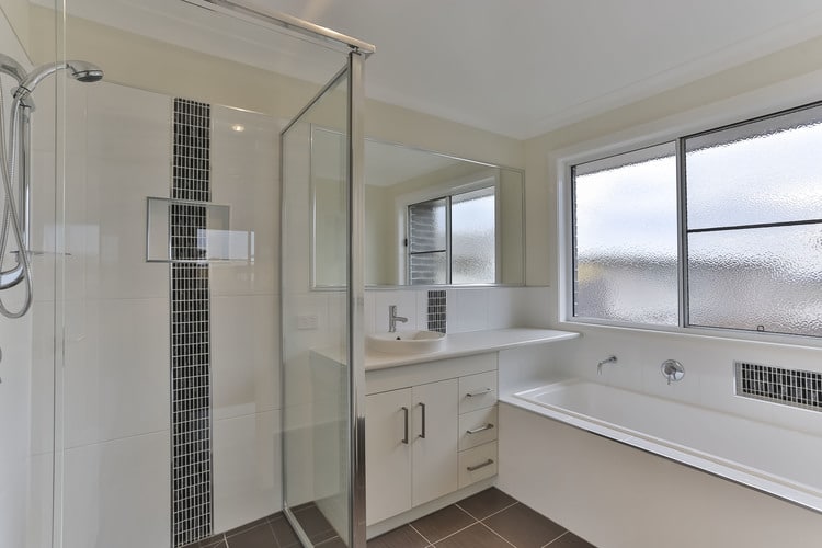 White, grey and brown tiled bathroom