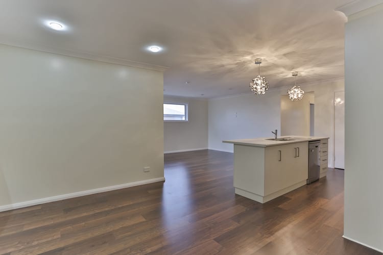 White walled lounge, kitchen and dining area