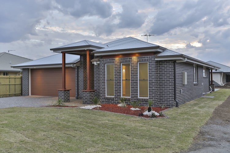 Front view of dark brick home by Toowoomba builder in Westbrook