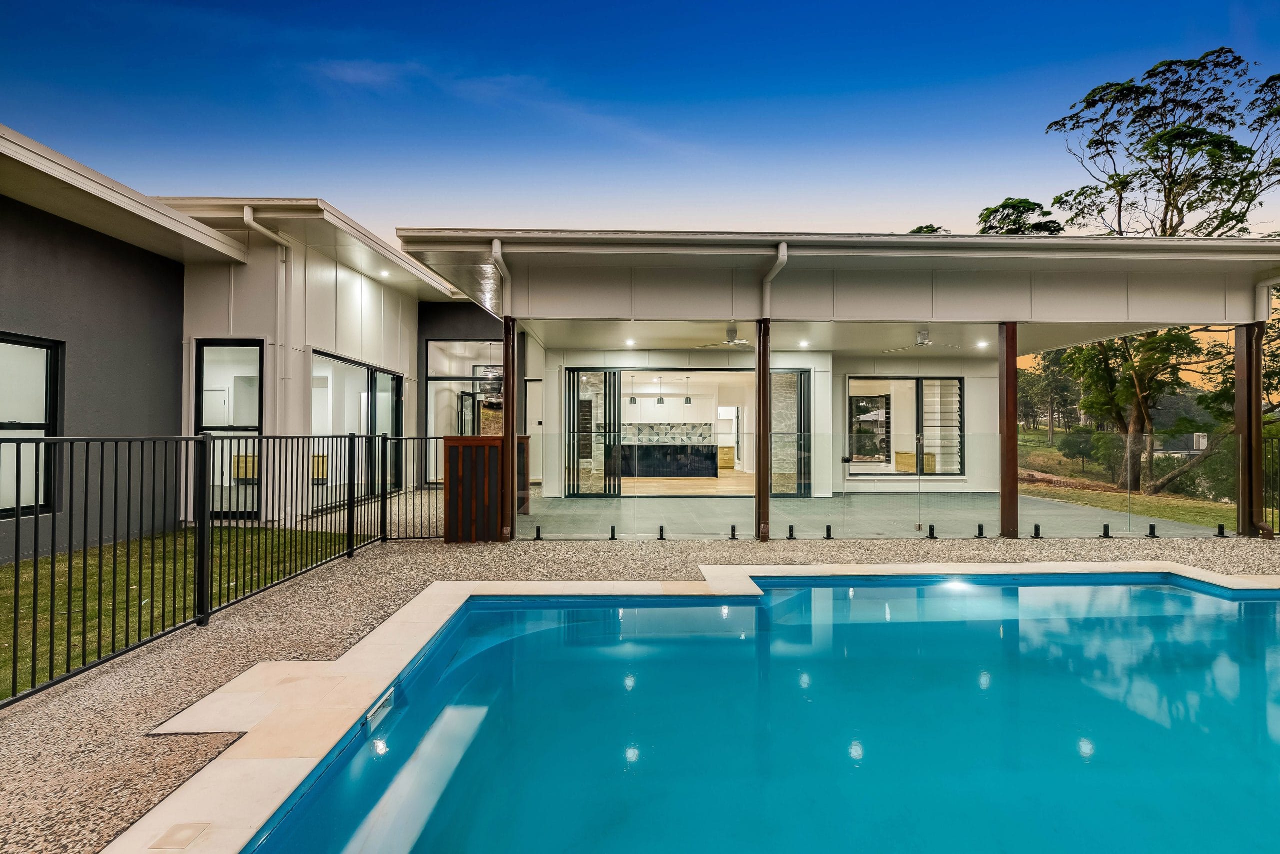 Outdoor photograph featuring trees and pool