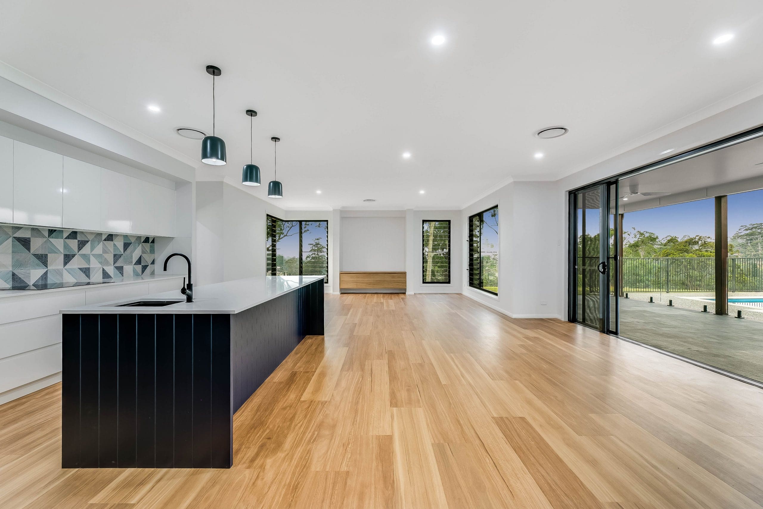 Indoor kitchen in blue colours with timber floors